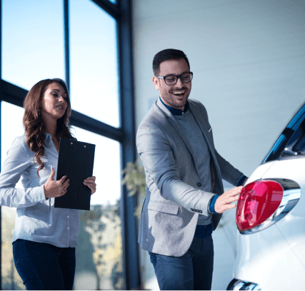Salesperson Showcasing Car
